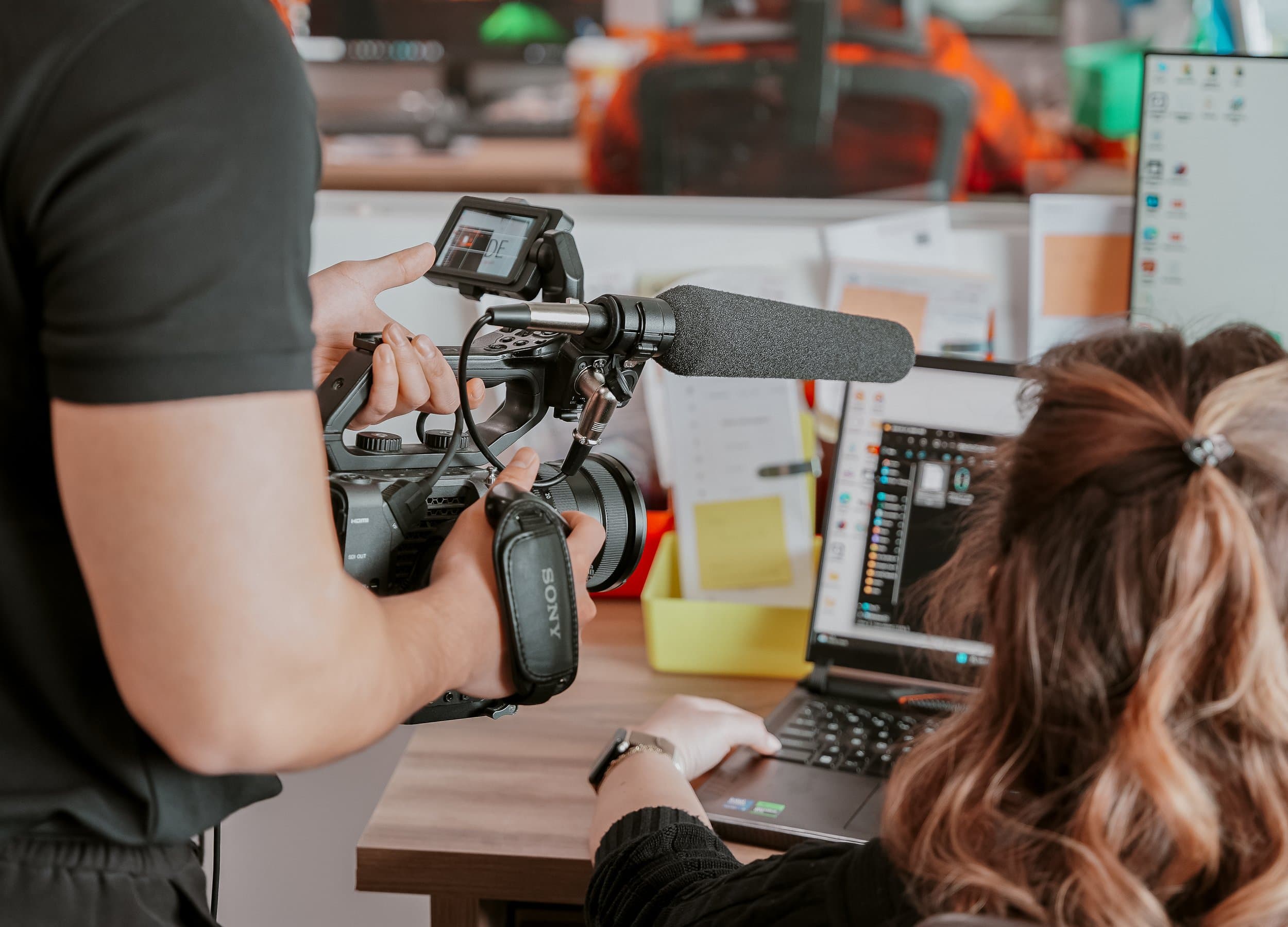 A camera operator covering a live business event